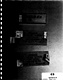 Photo #69, GPS, depicting blue plastic slide mailer and 2 closed cardboard slide mailers described as follows: '1 Glass slide containing hairs from Q79 PC-L2082 PMS MPM'; '1 Glass microscope slide containing Fibers from Q79 PC L2082 PMS MPM.'