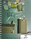 Photo #86, GPS, depicting evidence bag and contents as described in Exhibit 26, with slide mailers open; (Left) containing glass microscope slide marked: 'L2082 Q87 PMS MPM'; (Right) empty
